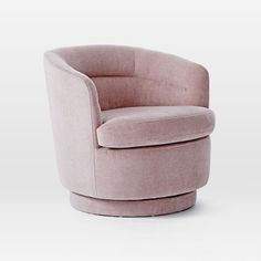 a pink swivel chair sitting on top of a white floor