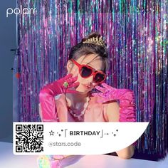 a woman wearing sunglasses and a tiara sitting in front of a purple curtain with the words polar on it