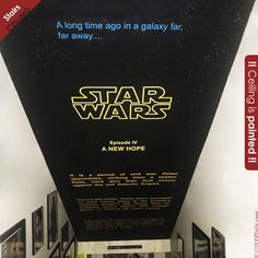 a star wars movie poster hanging from the ceiling