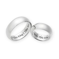 two wedding rings with words engraved on the inside and outside, one is white gold