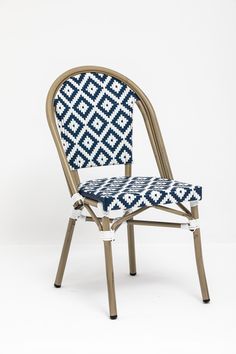 a blue and white patterned chair against a white background with the seat upholstered