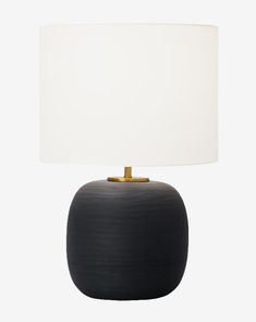 a black table lamp with a white shade