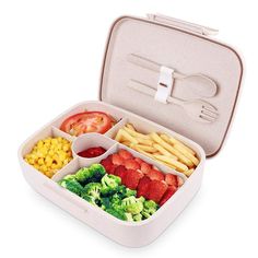 a bento box filled with different types of food including broccoli, strawberries and corn