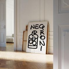 a white room with a black and white sign on the floor in front of it