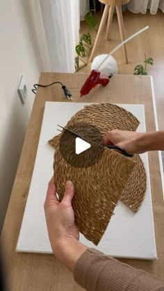 a person is working on a piece of art that looks like a dog's head