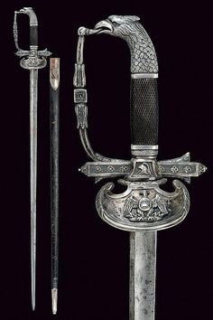 an old knife and dagger are on display