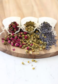 three bags filled with different types of herbs