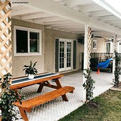 a pool table sitting on top of a patio next to a blue hammock