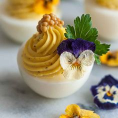 an assortment of desserts with flowers on them