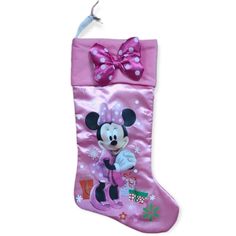 a pink christmas stocking with minnie mouse on it