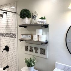 the bathroom is decorated in white and black