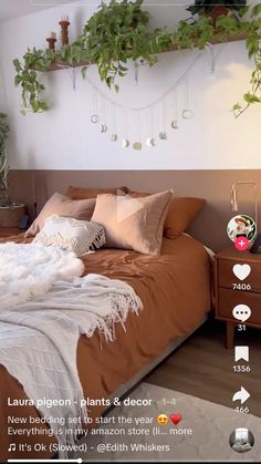 a bed room with a neatly made bed and lots of plants on the wall above it