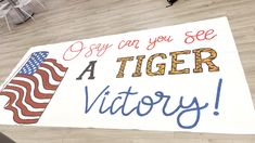 a large sign that says, i say can you see a tiger victory? on the floor