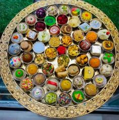 an elaborately decorated tray with many different types of buttons on it's surface