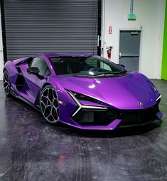 a purple sports car parked in a garage