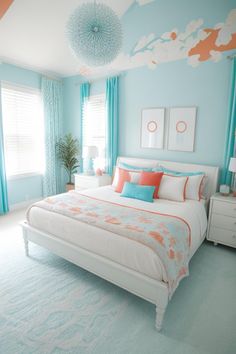 a bedroom with blue walls and white bedding, turquoise curtains and orange accents on the headboard