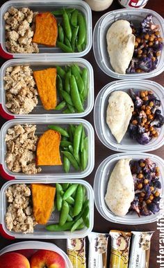 several plastic containers filled with different types of food