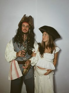 a man and woman dressed up as pirates