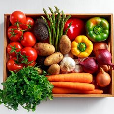 a box filled with lots of different types of vegetables