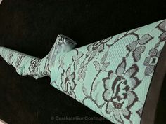 a close up of a bow tie on a black velvet chair with a snake skin pattern