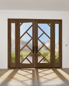 an open wooden double door in a white room with light coming through the glass doors