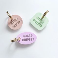 three keychains with the words micro chip, micro chip and micro chip printed on them