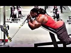 a woman doing squats on a bench in a gym