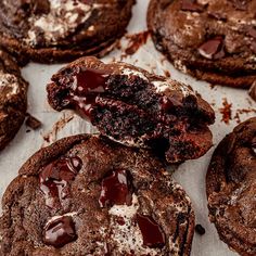 chocolate cookies with white and brown icing on top