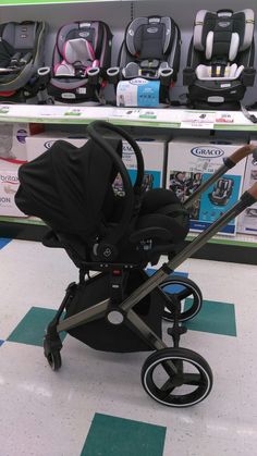 a baby stroller sitting on the floor in a store