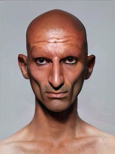 an image of a bald man's head with no shirt on and one eye open