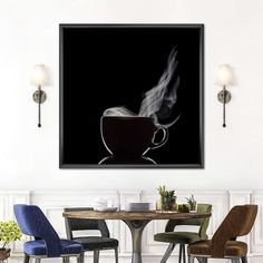 a coffee cup with steam coming out of it sitting on a table in front of two chairs