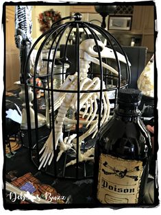 there is a bottle and skeleton in the cage