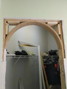 an arch in the wall is being constructed to look like it has been built into a closet