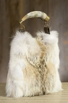 The Austin Fur Handbag goes wild in natural fur that looks and feels amazing, and packs some oomph into daytime or evening clothes. Free shipping + returns. Evening Clothes, Soft Decor, Fur Handbag, Fur Purse, Fur Handbags, Coyote Fur, Mode Chanel, Black Glamour, Cow Horns