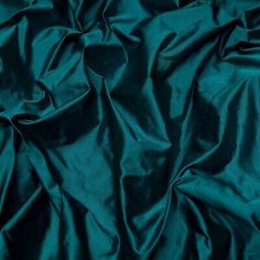 a dark green fabric with very thin folds