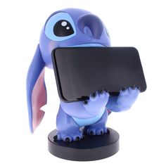 a small blue toy with an electronic device in it's mouth and hands on its back