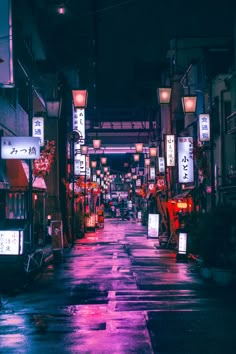 an alley way with lights and signs on it