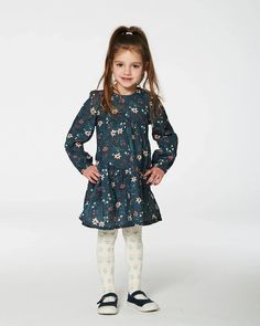 She'll look and feel oh-so-adorable in our Long Sleeve Muslin Dress Teal Printed Flowers. Featuring a pretty allover floral print, this cotton dress boasts long sleeves with elastic wrists, a round neckline, and a loose A-line silhouette with asymmetrical seams. It's a must-have for the girl who loves a twirl-worthy look! Knitted Flower Pattern, Printed Flowers, Muslin Dress, Knitted Flowers, Jacquard Pattern, Set Outfit, Solid Tops, Girls Long Sleeve, Shop Swimwear