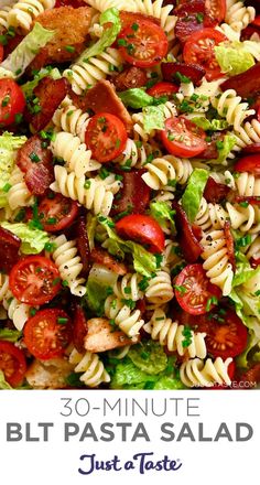 a pasta salad with tomatoes and lettuce in it