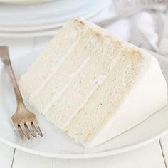 a piece of cake sitting on top of a white plate next to a silver fork