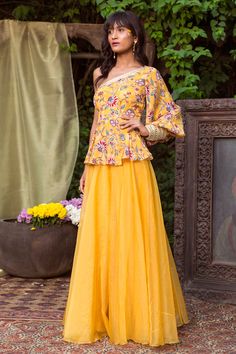 This set features a yellow lehenga with a printed blouse and embroidered dupatta. Color: Yellow Fabric: Georgette; Organza; Crepe Care: Dry Clean Only Mehndi Outfit Ideas For Bridesmaid, Dresses For Mehndi Function, Indo Western Dresses, Mehndi Function, Haldi Dress, Mehndi Outfit, Mehndi Outfits, Haldi Outfits, Haldi Outfit