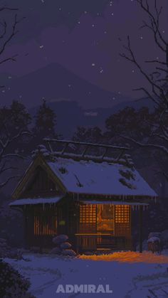 the cabin is lit up at night in the snow