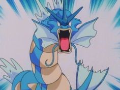 a blue and white dragon with its mouth open