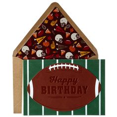 a football themed birthday card with the words happy birthday written on it and an envelope