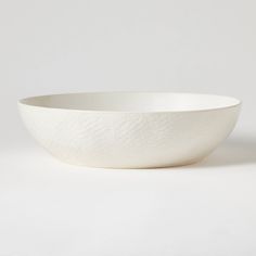 a white bowl sitting on top of a table