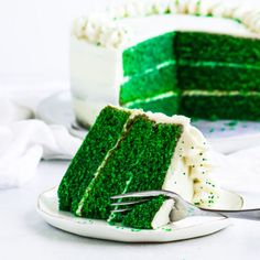 a green velvet cake on a plate with a fork