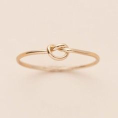 This delicate knot ring is incredibly versatile! Worn solo, stacked or as the perfect midi. Gift this "love knot to your friends, family or someone who needs a lift. It's a beautiful token of the ties that weave our lives together. Details:Location: Finger (order larger or smaller sizes depending on which finger you choose to wear it)Thickness: 1mmSizes: 5,6,7,8Style: Minimalist/DaintyMade with: 14K Gold Filled Ring Inspo, Love Knot Ring, Knot Ring, Love Knot, Tie Knots, Cute Jewelry, Rose Gold Ring, Gold Filled, Gold Rings