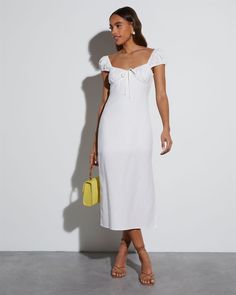 An exceptional choice for brides-to-be, the Bridal Bliss Sweetheart Midi Dress features clean lines in a classic, A-line fit. This midi dress has a cute side slit, sweetheart neckline, cap sleeves, and non-functional front tie. Sweetheart neckline Cap sleeves Side slit Midi length Side zipper closure Self: 55% Linen 45% Rayon, Lining: 100% Rayon Sweetheart Midi Dress, White Tight Dresses, Cottage Dress, Milk Maid, White Short Sleeve Dress, Vici Dress, Spring Break Outfit, Midi Wrap Dress, Linen Midi Dress