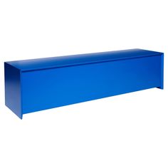 a blue shelf sitting on top of a white wall