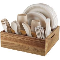 a wooden box filled with white dishes and silverware